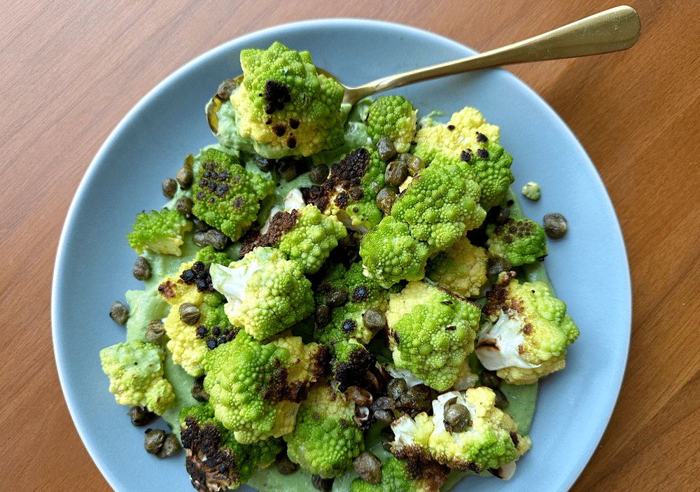 A Big Blue Platter Of Bright Green Romanesco Arranged On A Creamy Green Sauce