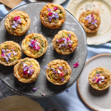 Asparagus Quiches Shot Top Down With Florals On Them Feast